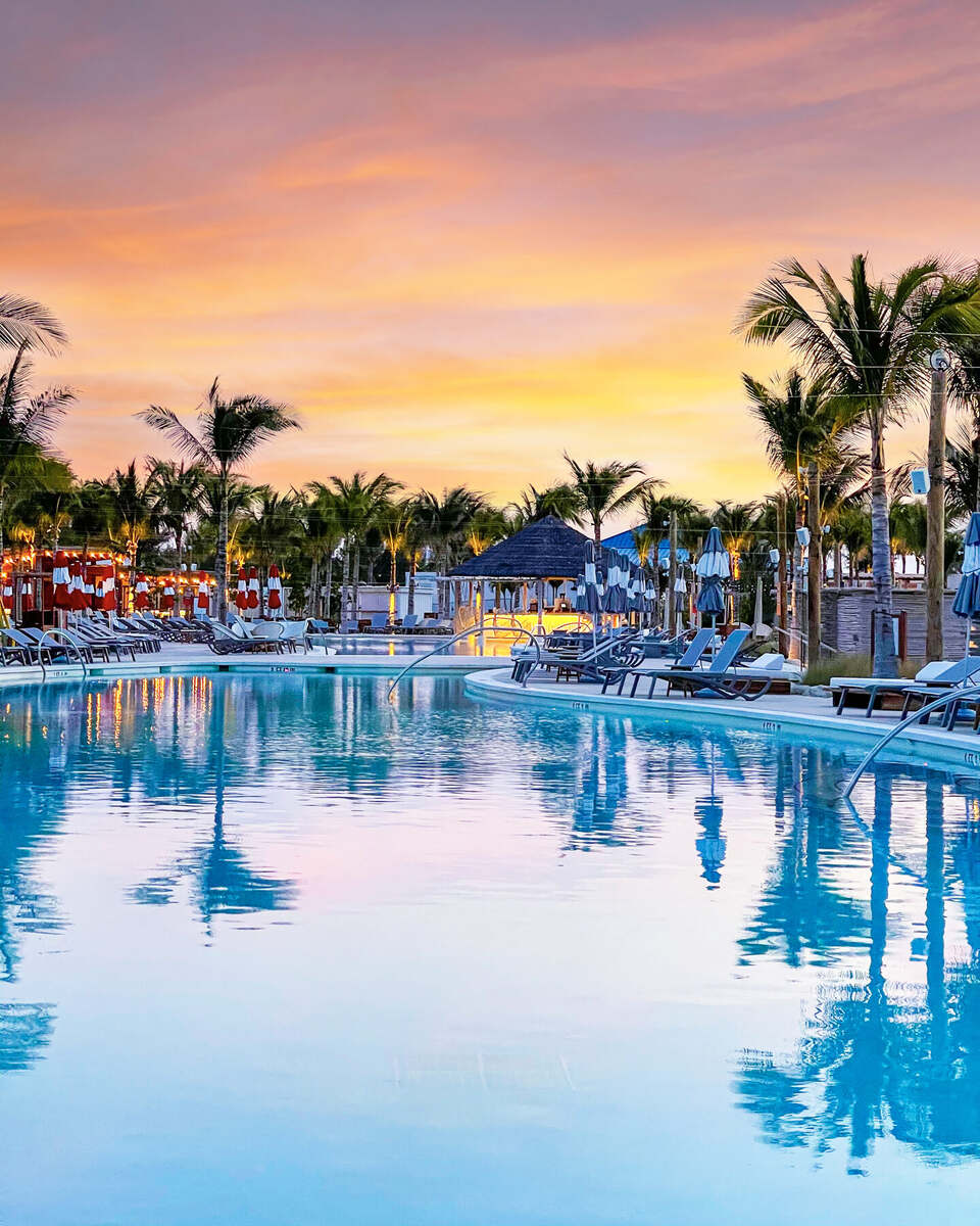Poolside loungers at sunset at Bimini Beach Club