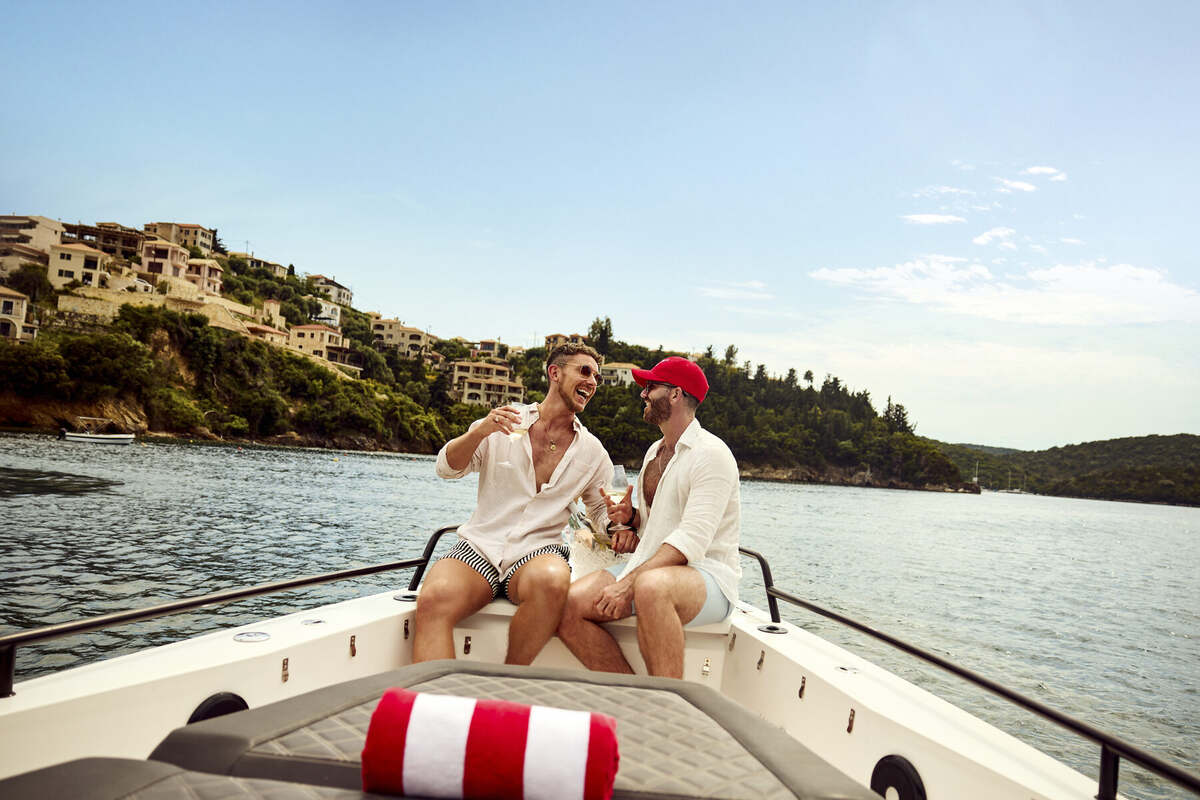 Friends on a private boat exploring the Corfu coastline